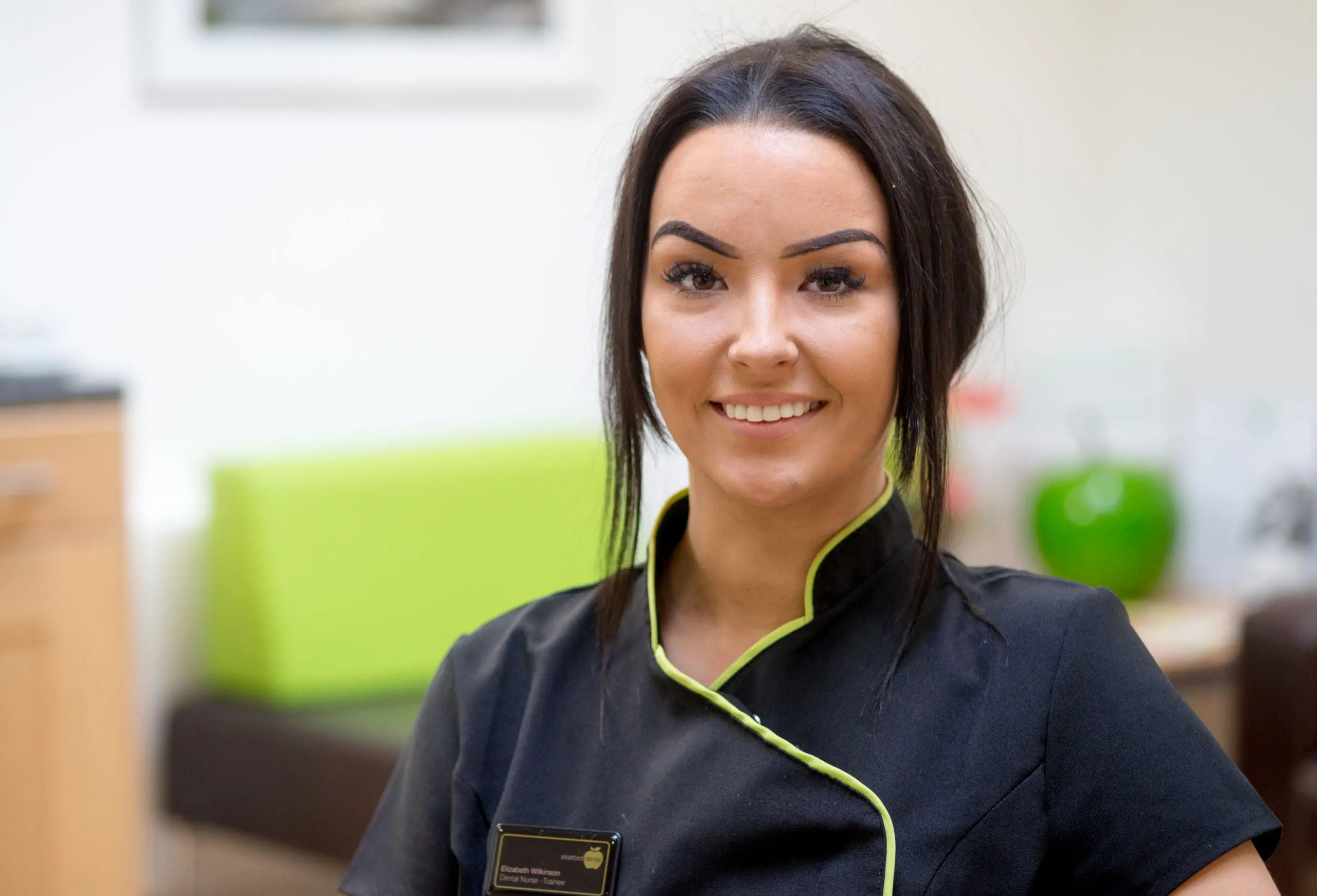 Smiling dental nurse in uniform