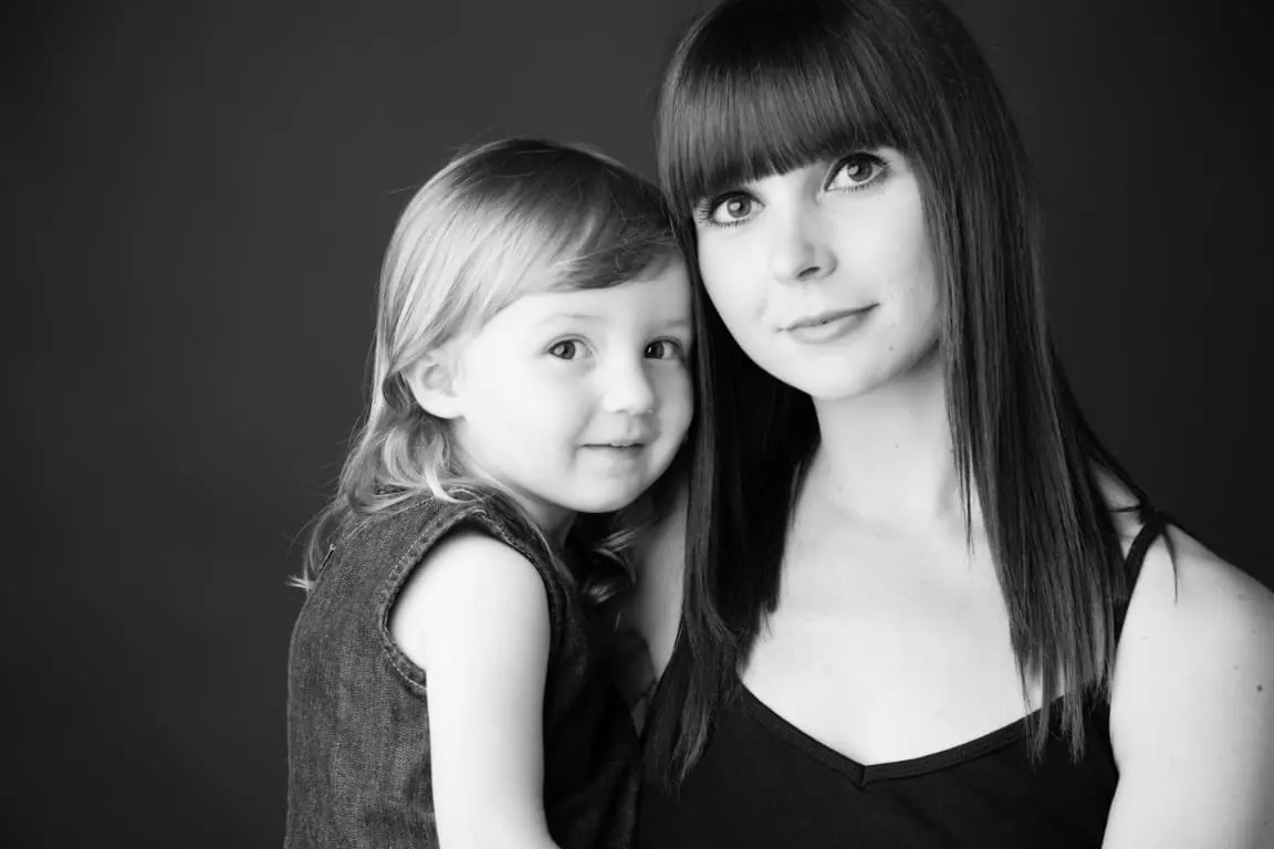 Mother and child in a black and white portrait.